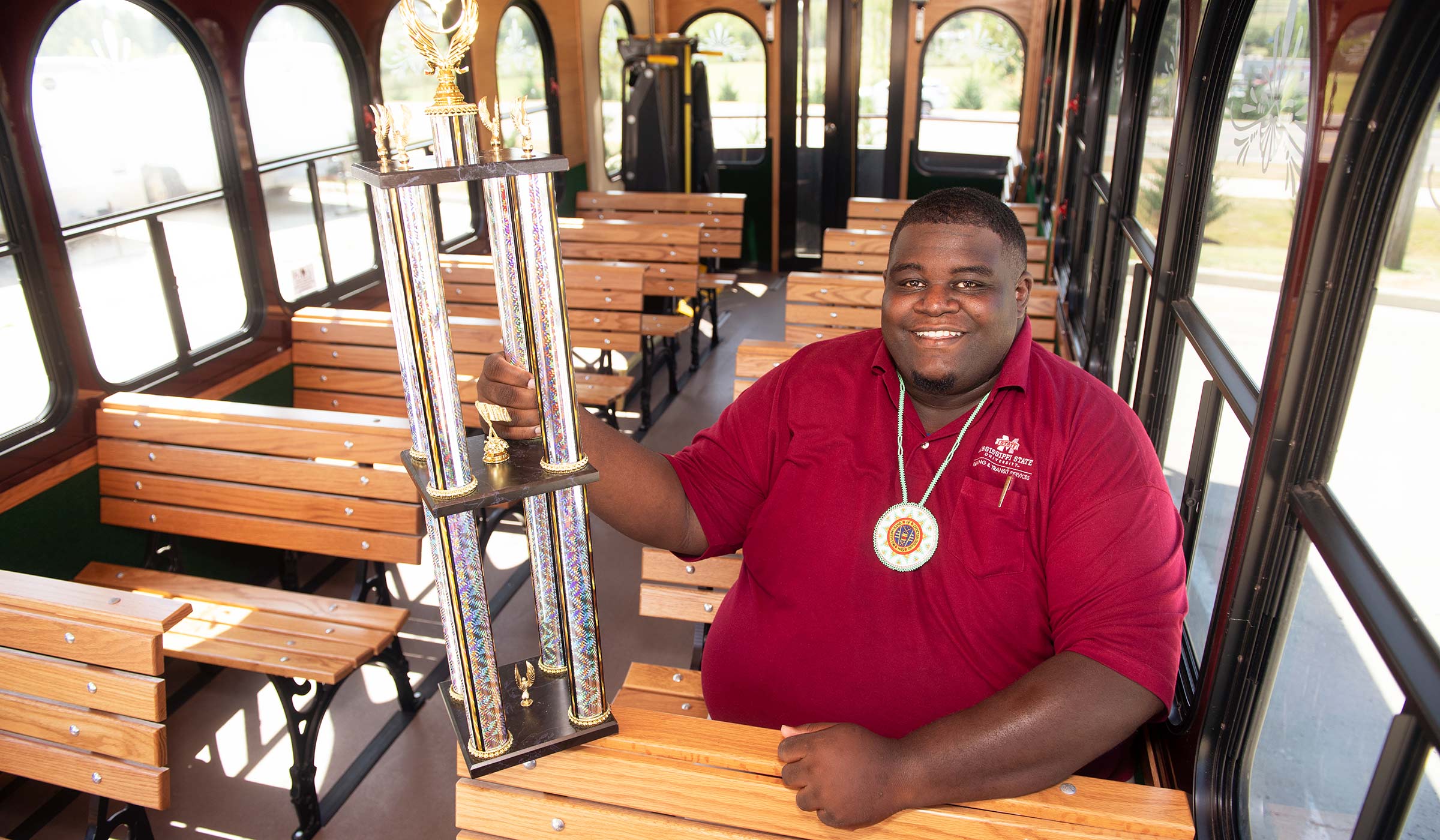 Taquantis Koger, pictured holding a large driving trophy.