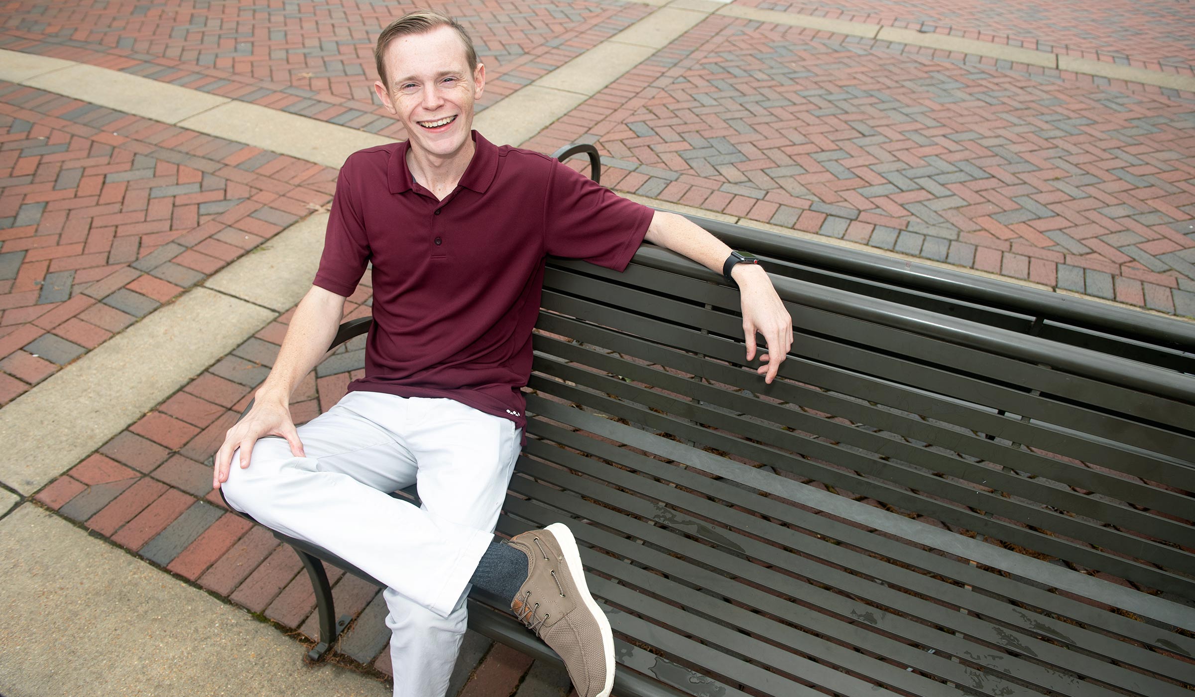 Payton Burns, pictured on a bench on the MSU campus