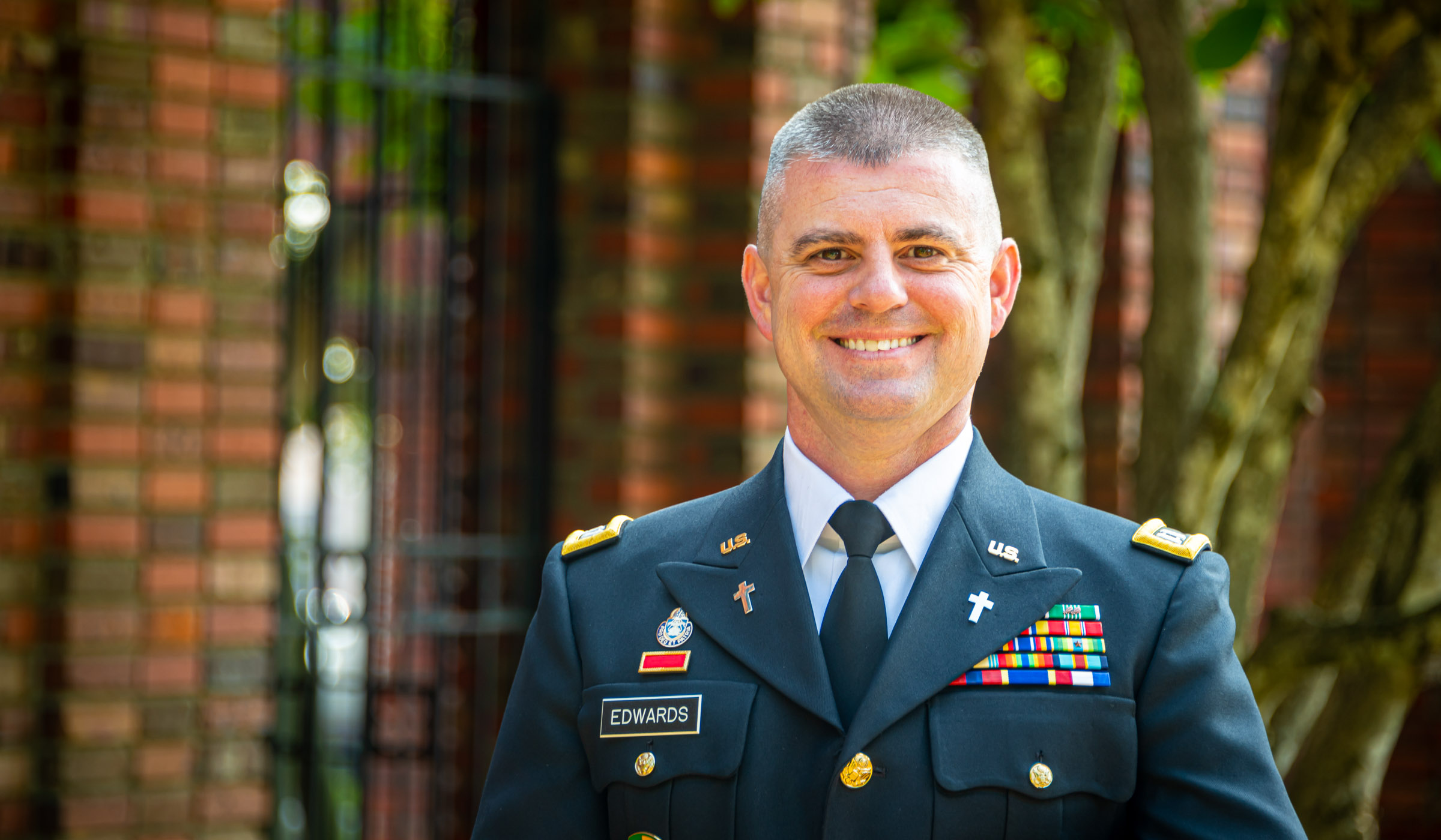 Scott Edwards is pictured in uniform near the Chapel of Memories