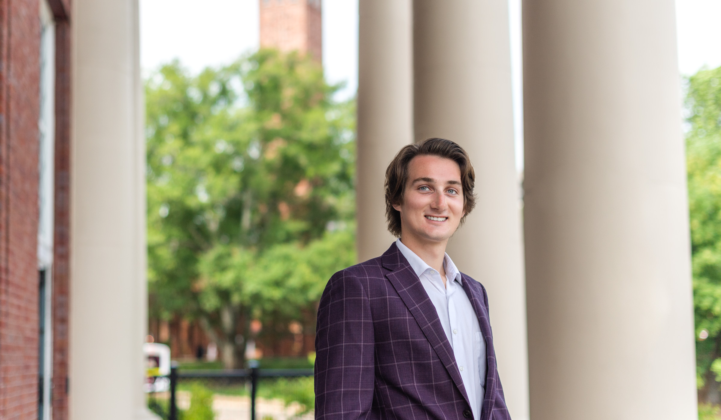 Seth Sloan, pictured on the porch of Old Main Academic Center