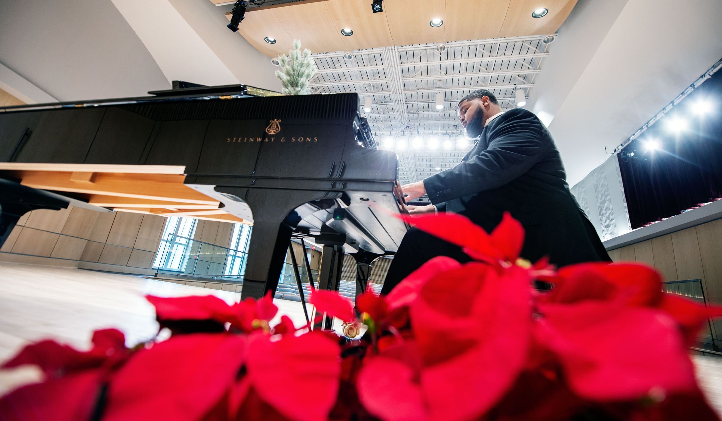 Desmond Henderson, pictured playing a Steinway piano in MSU&#039;s new Music Building