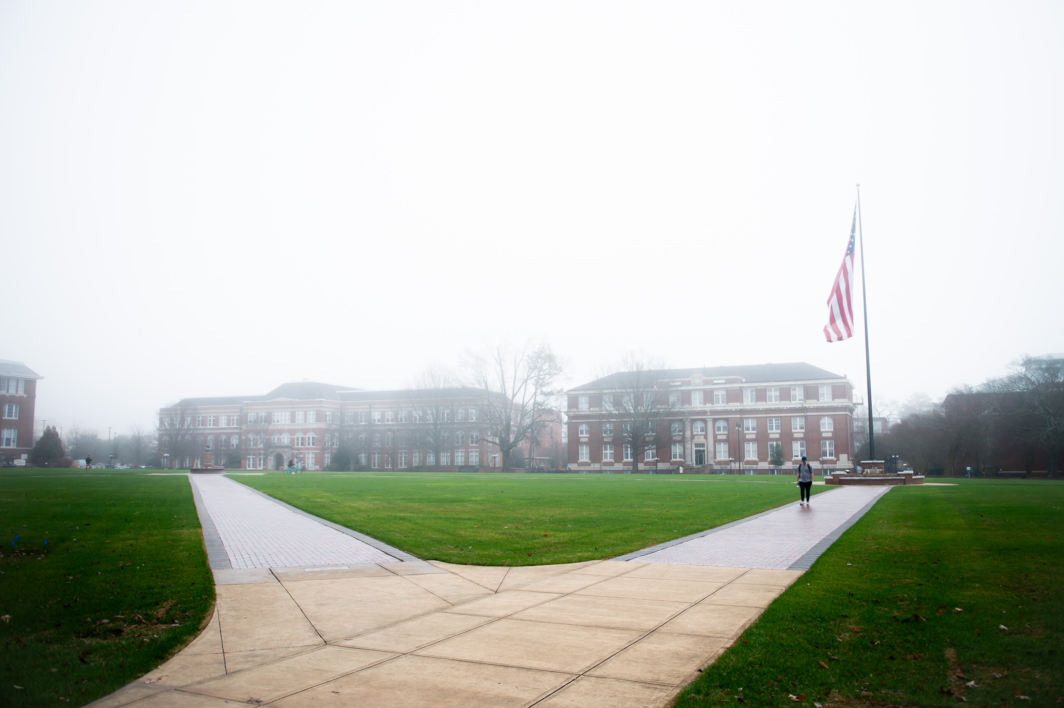 A thick blanket of fog hovers above the Drill Field, creating a wispy Wednesday morning.