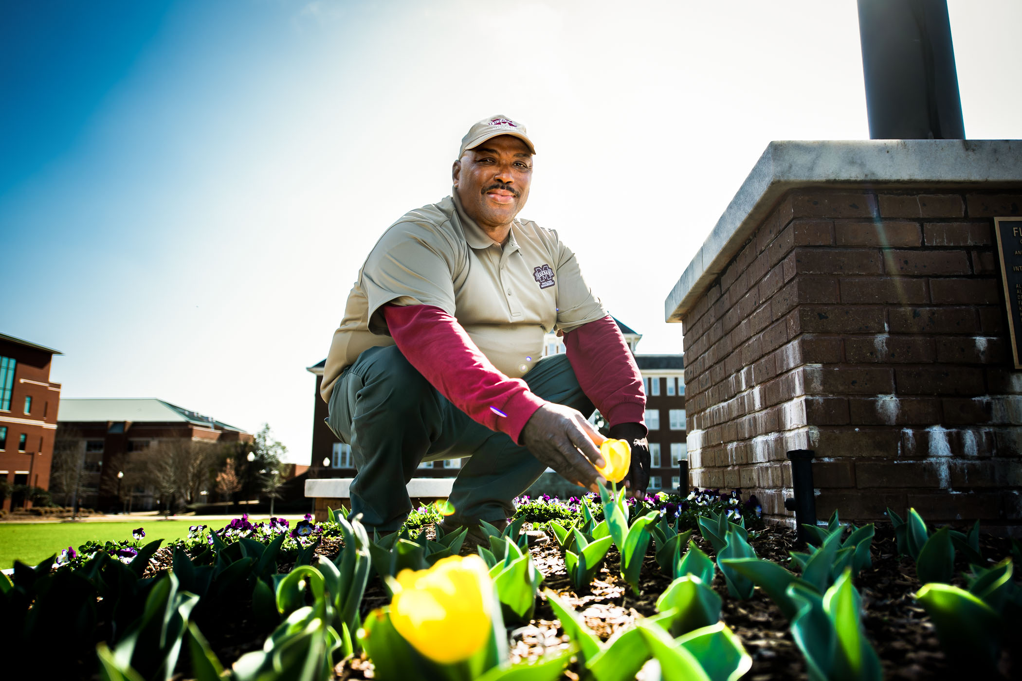 Gussie Lane, pictured tending a flower bed on the MSU Drill Field