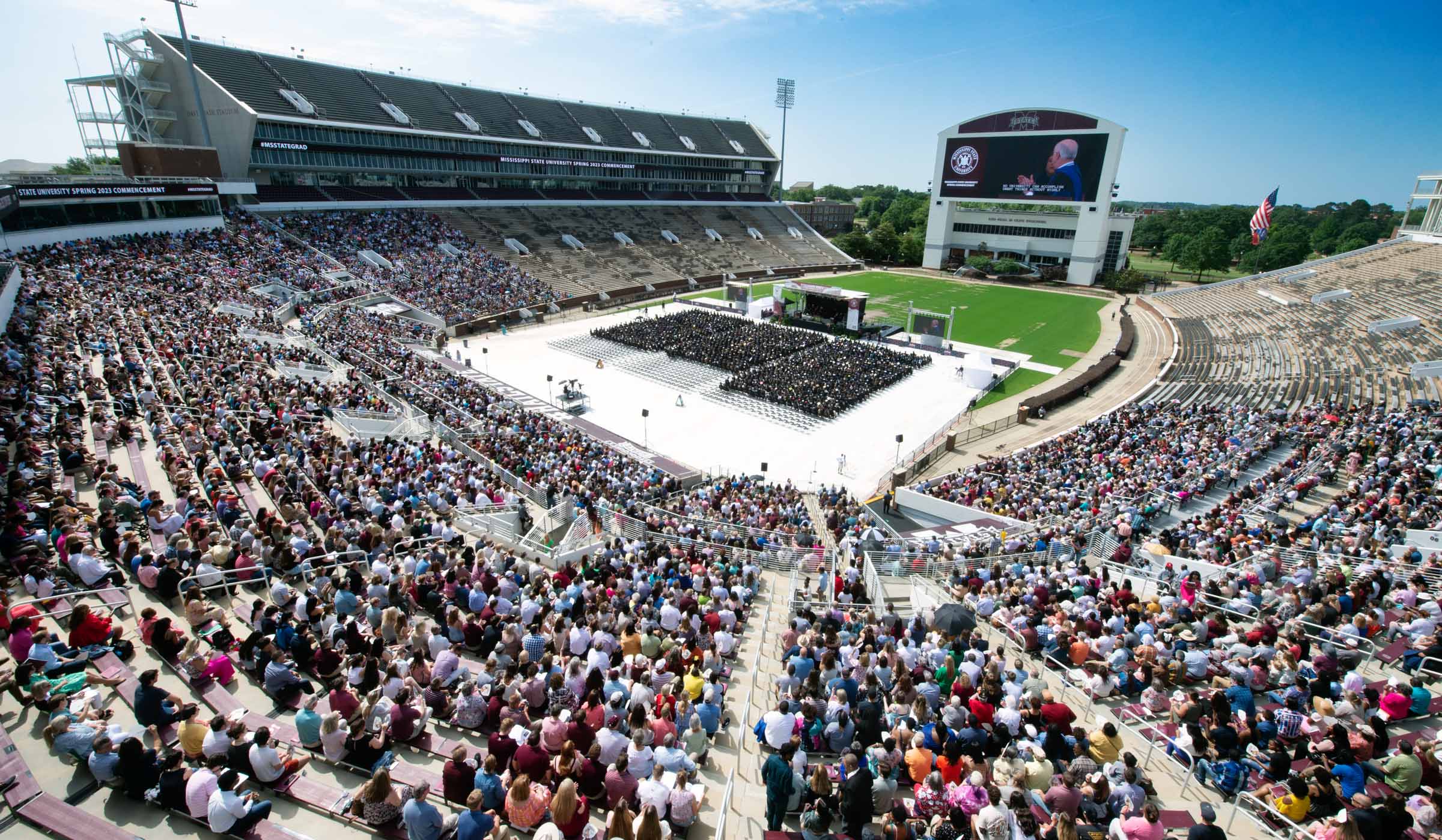 A wide view of the morning Spring Commencement ceremony at Davis Wade Stadium, as seen from above, looking Southeast.