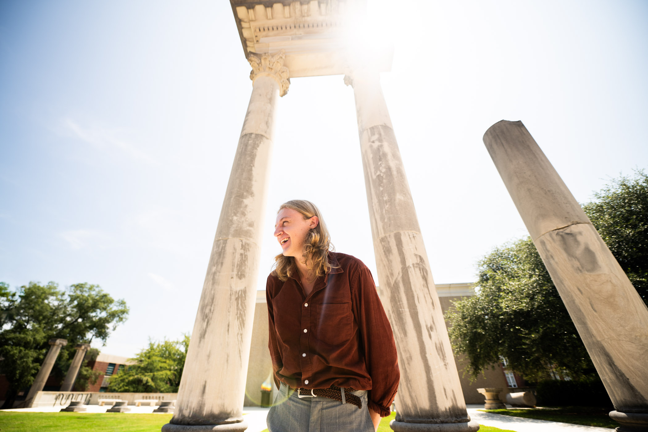 Aidan Taylor, pictured in front of replicas of ancient ruins in front on the MSU campus