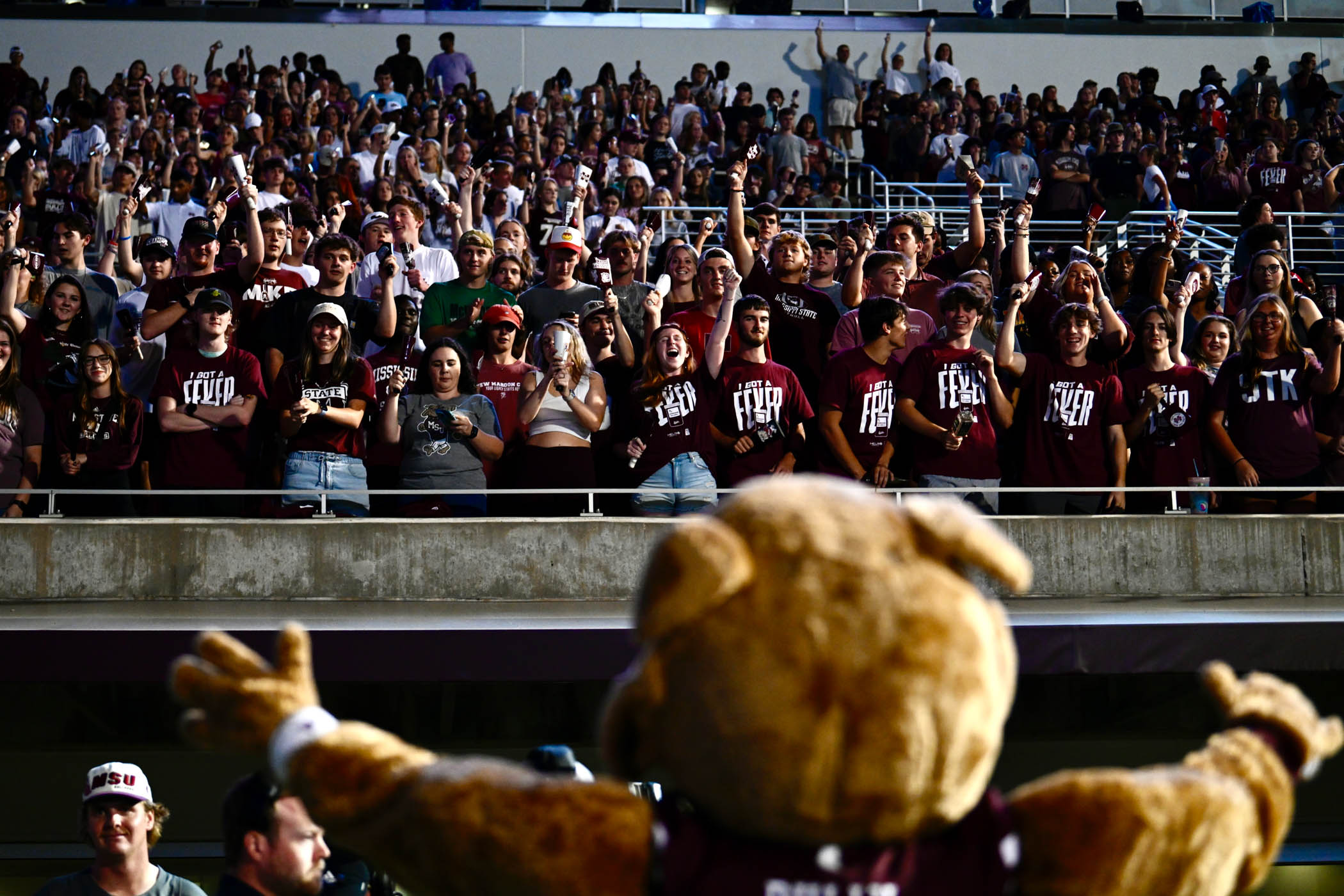 Bully engages with a crowd of MSU students at Cowbell Yell, a night pep rally to kick off the first football game of the season.