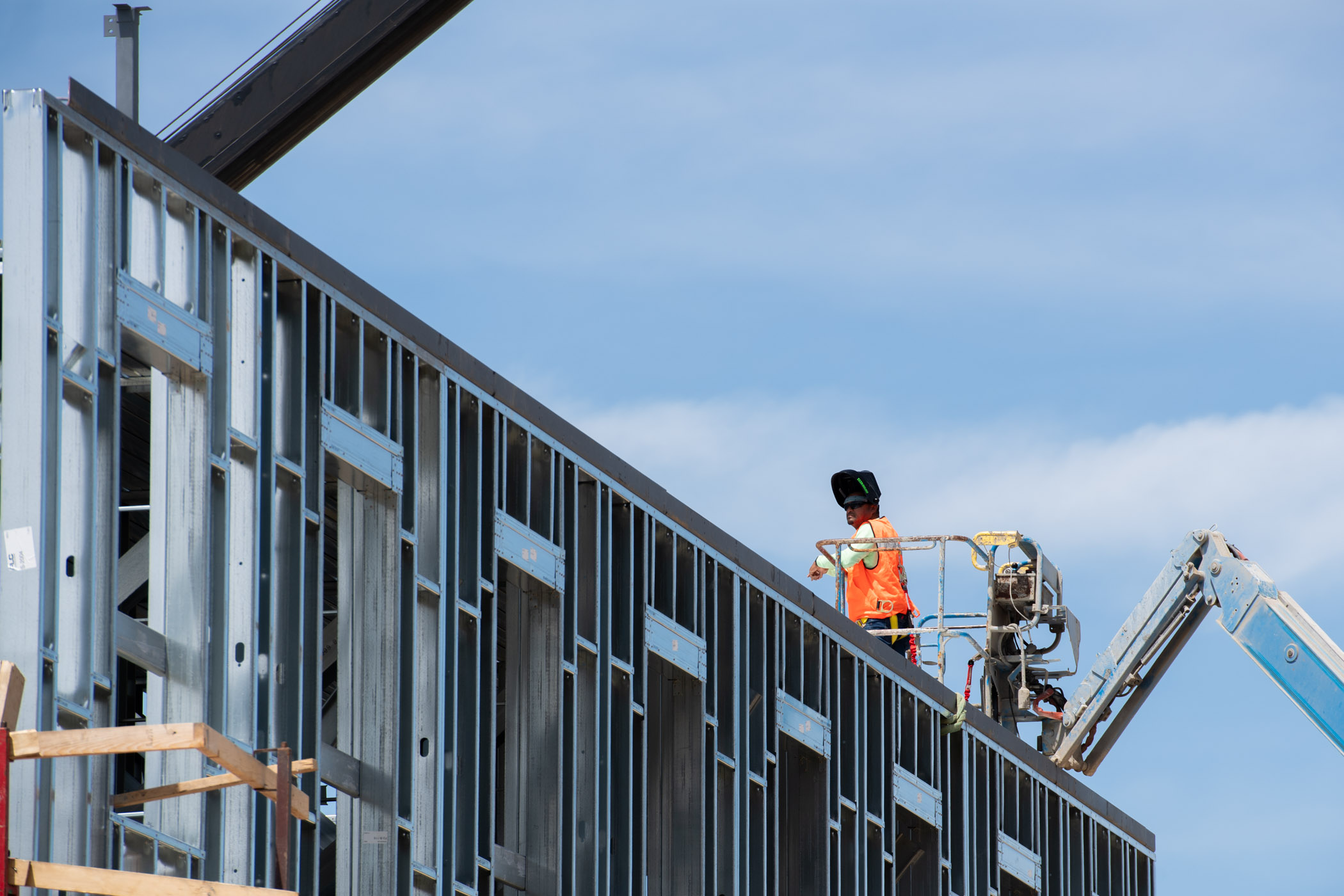 A construction worker atop Azalea Hall