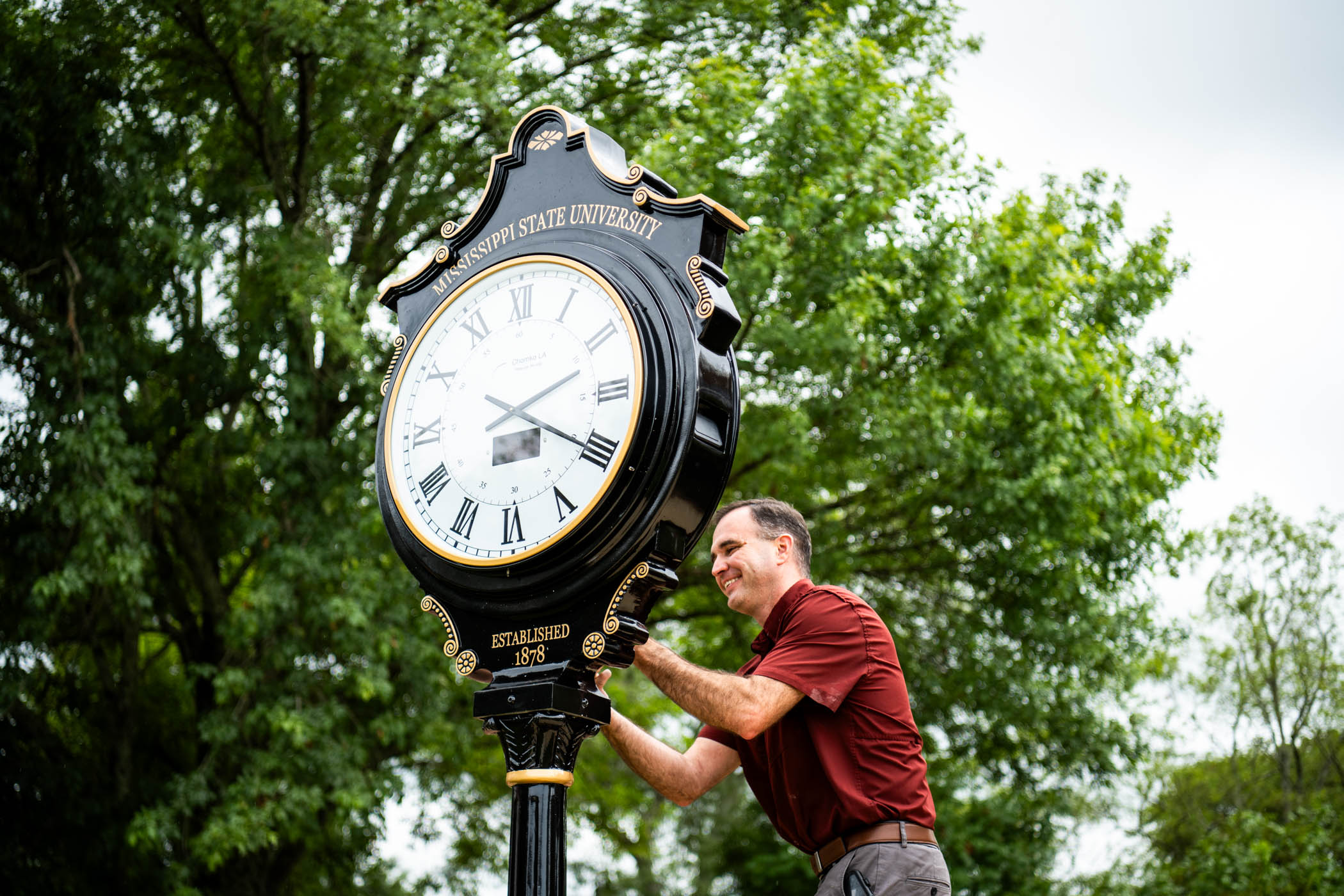 Jesse McCarter, a building services supervisor for MSU Campus Services, meticulously sets up a street clock in between Lee Hall and Colvard Student Union. With a variety of experts in fields such as engineering, design, skilled craftsmen, the Campus Services team of dedicated and talented members is responsible for managing, operating, and maintaining all buildings and utilities, custodial and landscape operations, and a wide variety of construction projects. 