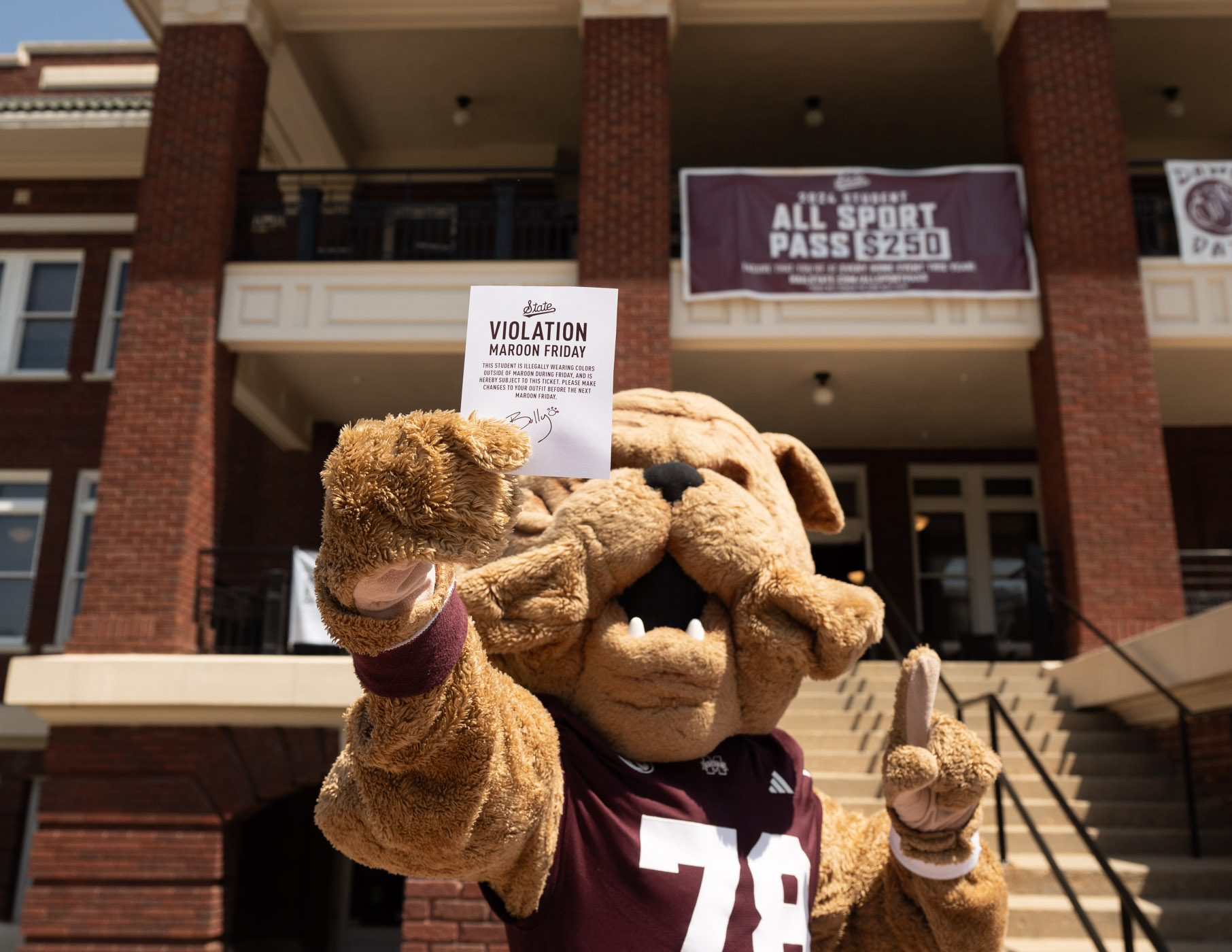 Bully prepares to playfully hand out “Maroon Friday Violations” to students not currently wearing maroon. The citation reads “Violation Maroon Friday – This student is illegally wearing colors outside of maroon during Friday, and is hereby subject to this ticket. Please make changes to your outfit before the next Maroon Friday.”