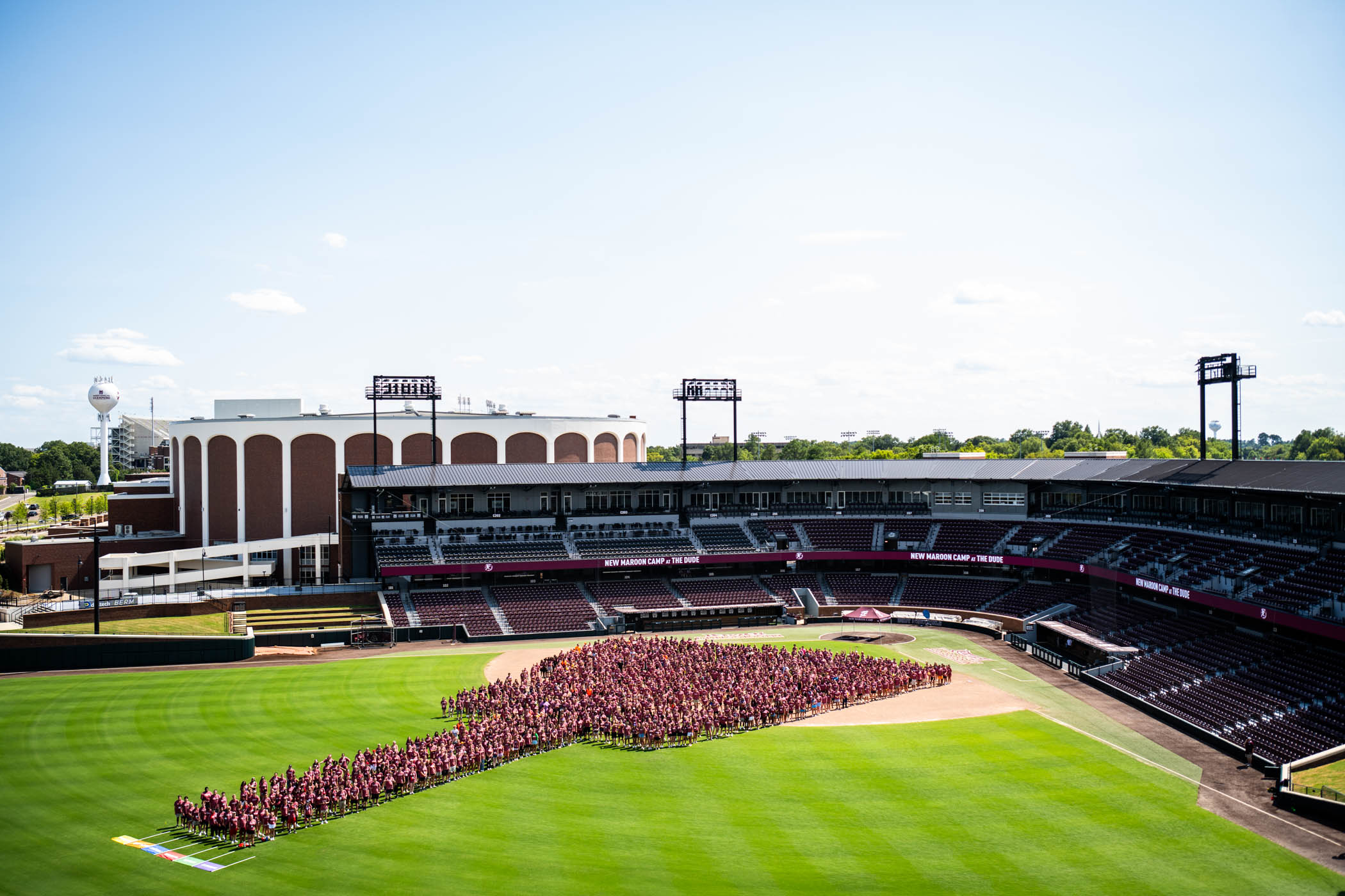 The New Maroon Camp Class of 2024 gathers together in center field to create a massive cowbell shape, a new tradition for MSU incoming freshmen! NMC is a week-long student-led retreat that prepares first-year students for the transition to Mississippi State University while learning MSU history and traditions, meeting other new students, discovering opportunities to get involved, and learning more about the MSU campus.