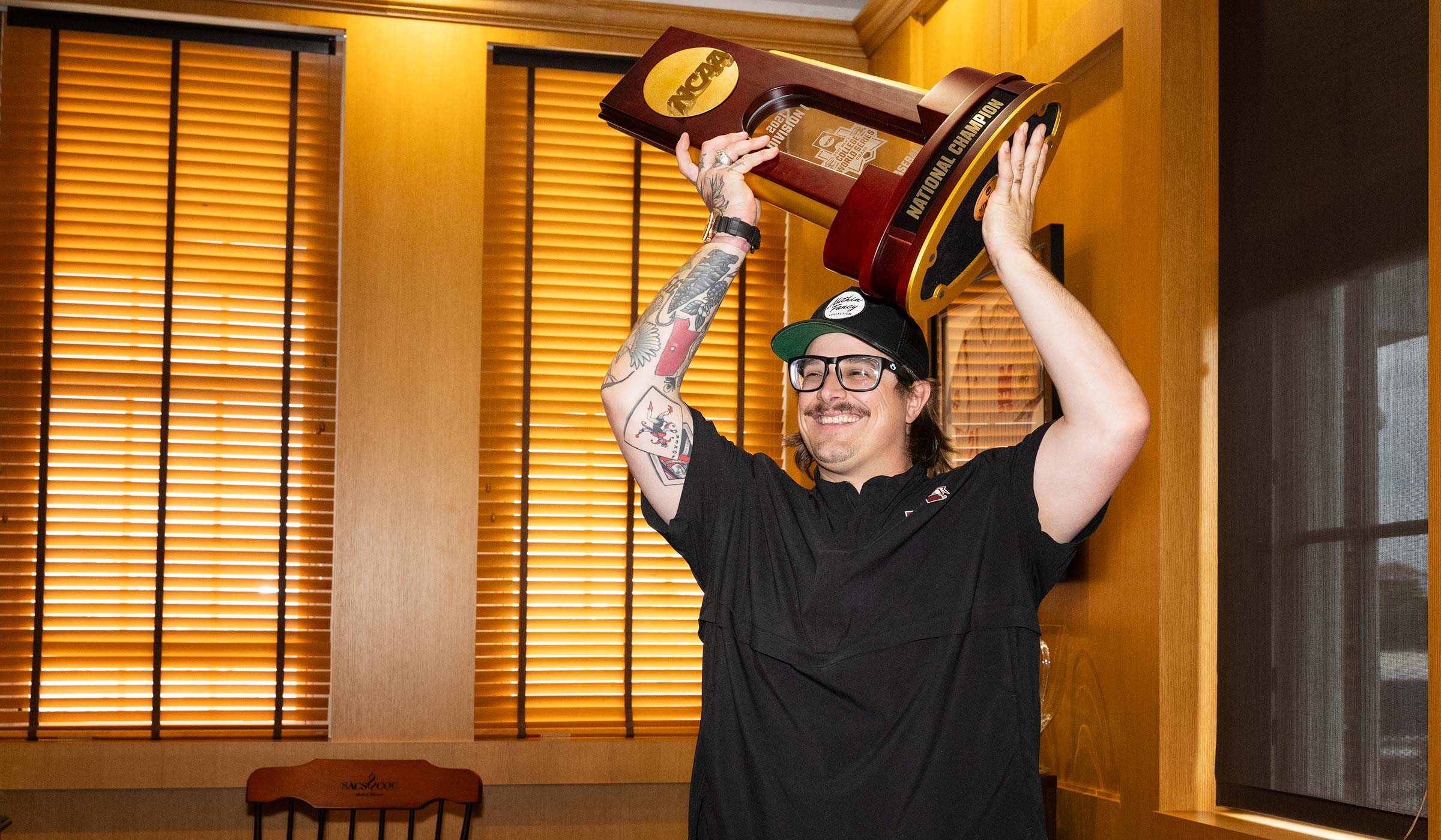 Country singer-songwriter HARDY lifts the Bulldogs’ 2021 baseball national title trophy in Mississippi State President Mark E. Keenum’s office. The Philadelphia native celebrated his birthday Friday [Sept. 13] before taking the stage for a live concert at Dudy Noble Field. 