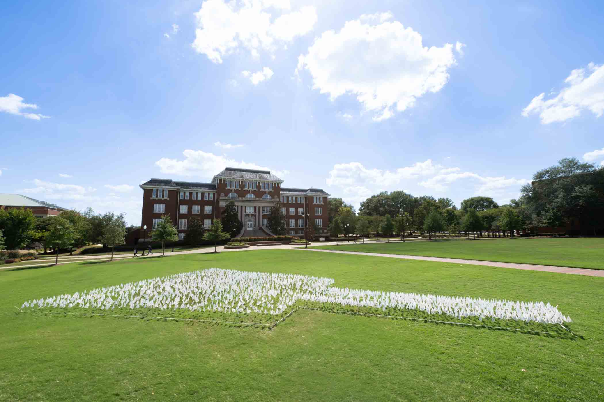 To celebrate the start of Graduate Student Welcome Week, The Graduate School has placed an arrangement of flags in the shape of a cowbell on the Drill Field. You can find the schedule of events for Graduate Student Welcome Week here.