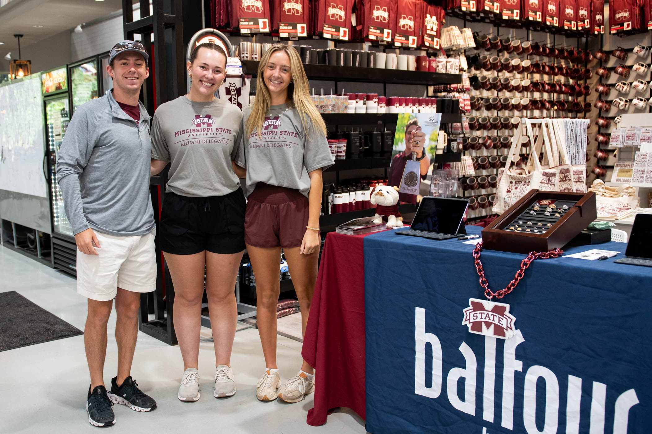 MSU Alumni Delegates, from left, Parker Kirby of Madison, Brianna Croft of Normal, Illinois and Josie Smith of Madison invite students to browse class ring options at Fall Ring Days, Sept. 18-20. The tabling event features various ring styles while teaching the tradition of class rings, how to find the right fit and the next steps to purchasing a little piece of history.  Learn more about class rings and the MSU Alumni Association by visiting here.