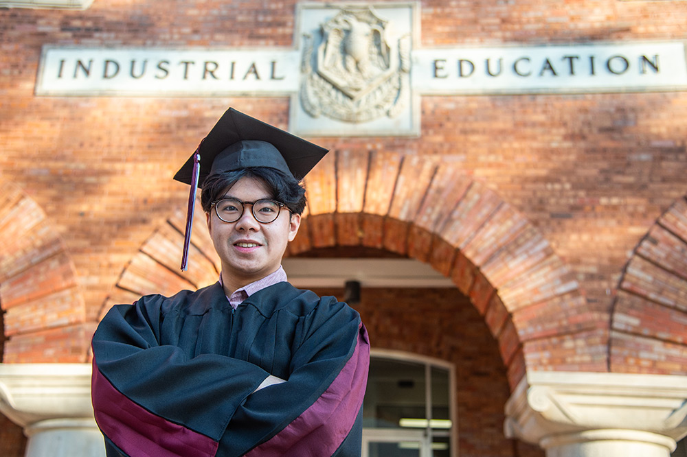 Danny Tran in front of the industrial engineering building