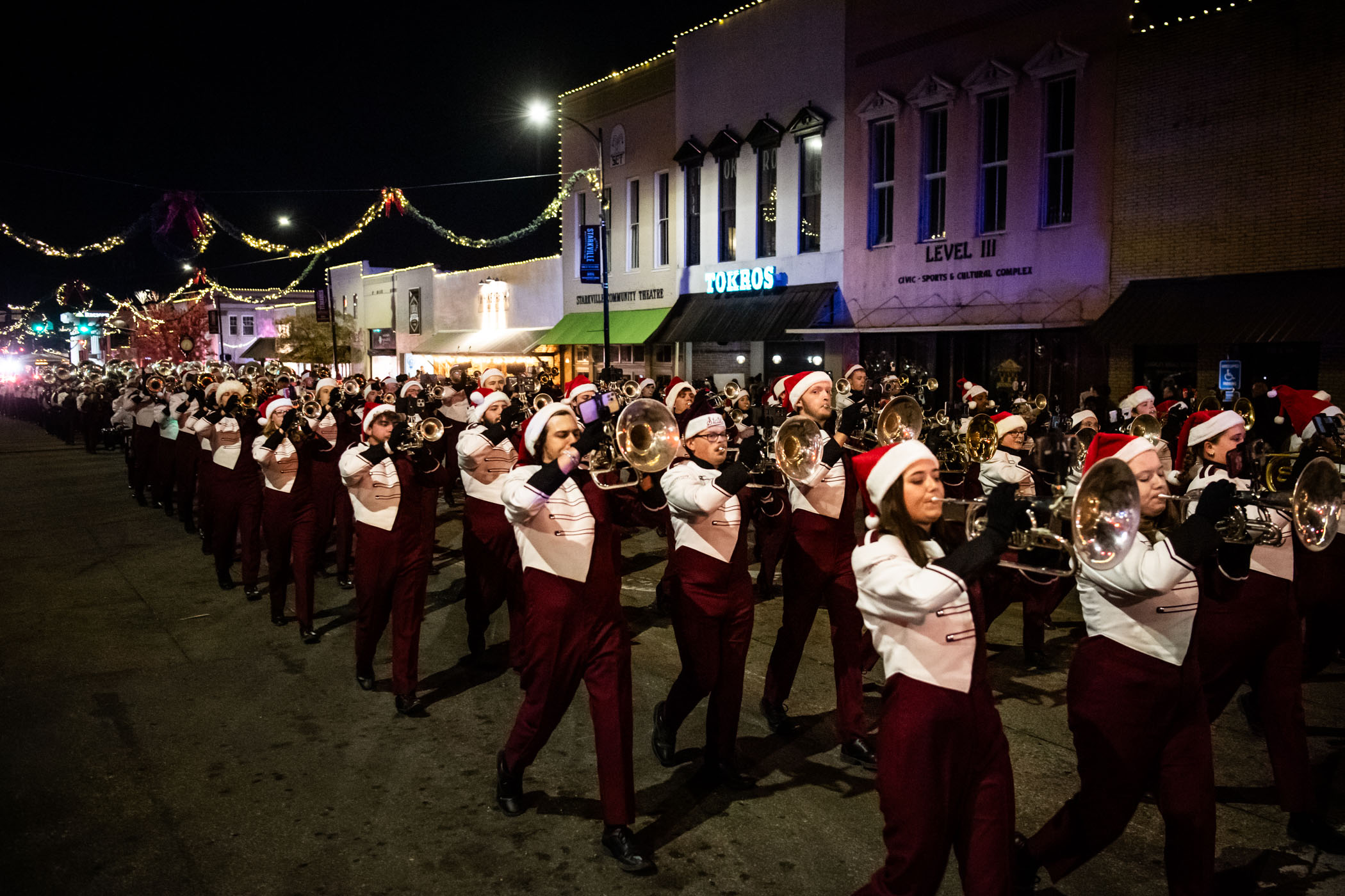 MSU&#039;s Famous Maroon Band marches along Main Street, spreading holiday cheer at the city&#039;s annual downtown Christmas Parade. The festivities featured decorated floats from local businesses, first responders, community  organizations, and even an appearance from Santa Claus! 