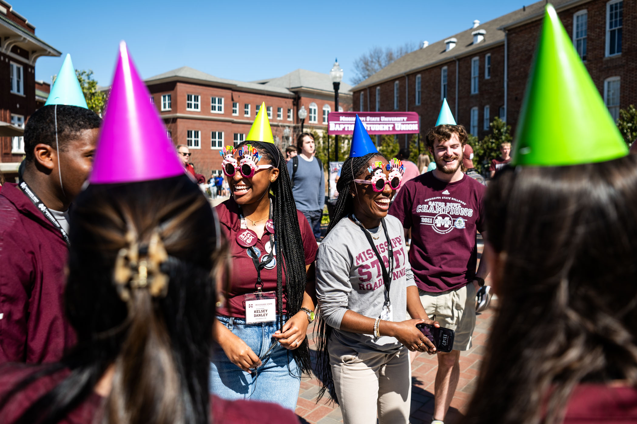 MSU Roadrunners Kelsey Danley and Keaura Mearday go the extra mile in festive style for MSU&#039;s 147th birthday party on YMCA Plaza.