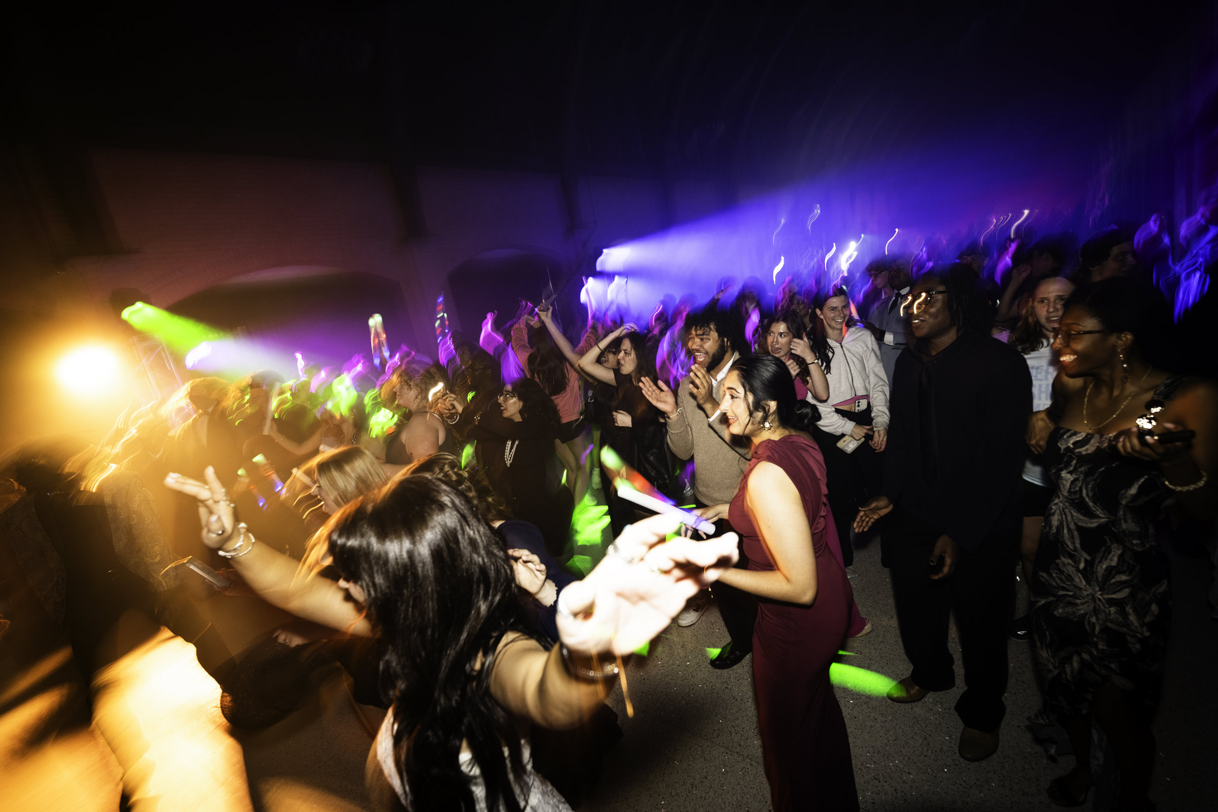 Students dance along to live music under colorful lights at State Soiree, a night of unforgettable fun in MSU's historic Perry Food Hall.