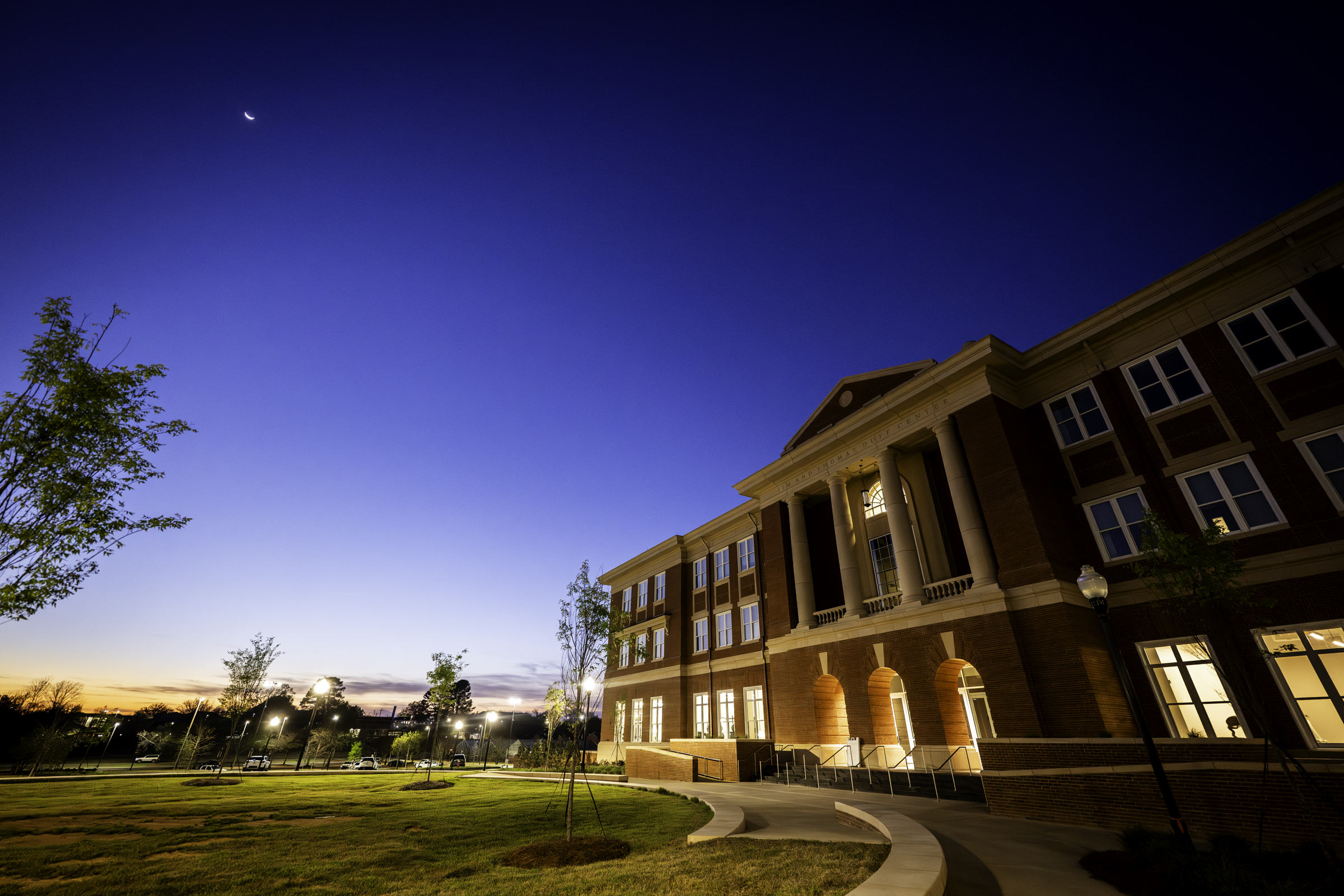 MSU's Jim and Thomas Duff Center is lightly illuminated against a deep blue dusk sky
