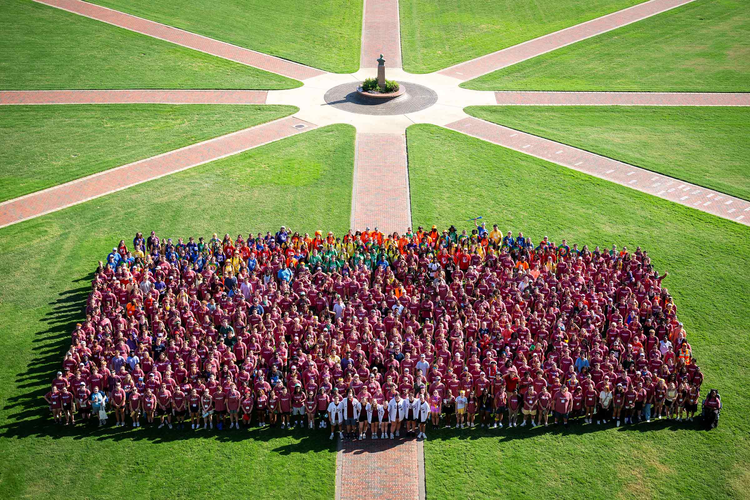 A group of New Maroon campers stand on Mississippi State's Drill Field. 