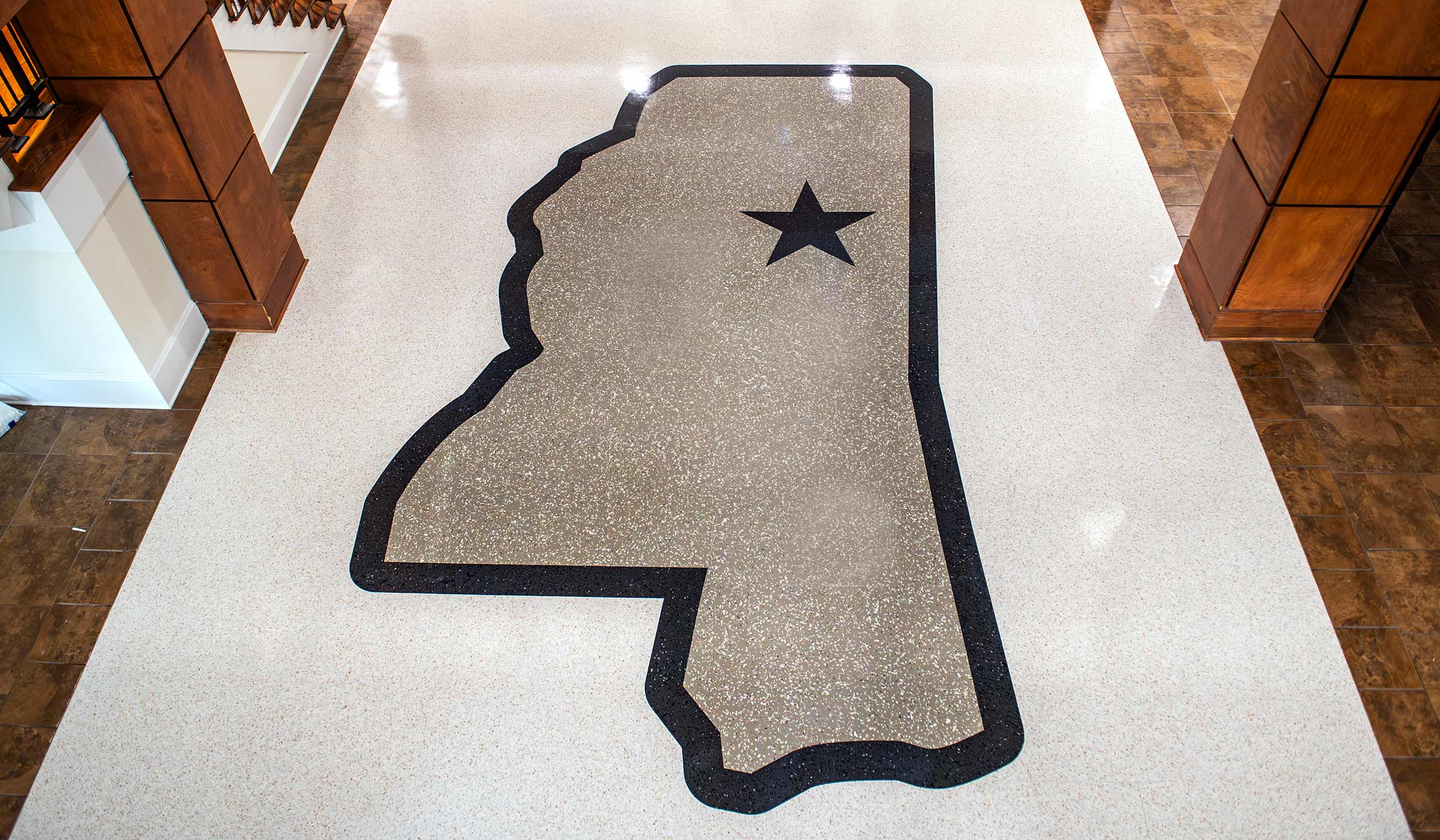 The newly renovated Griffis Hall lobby floor features the state of Mississippi outline with Starkville's location marked with a maroon star. 
