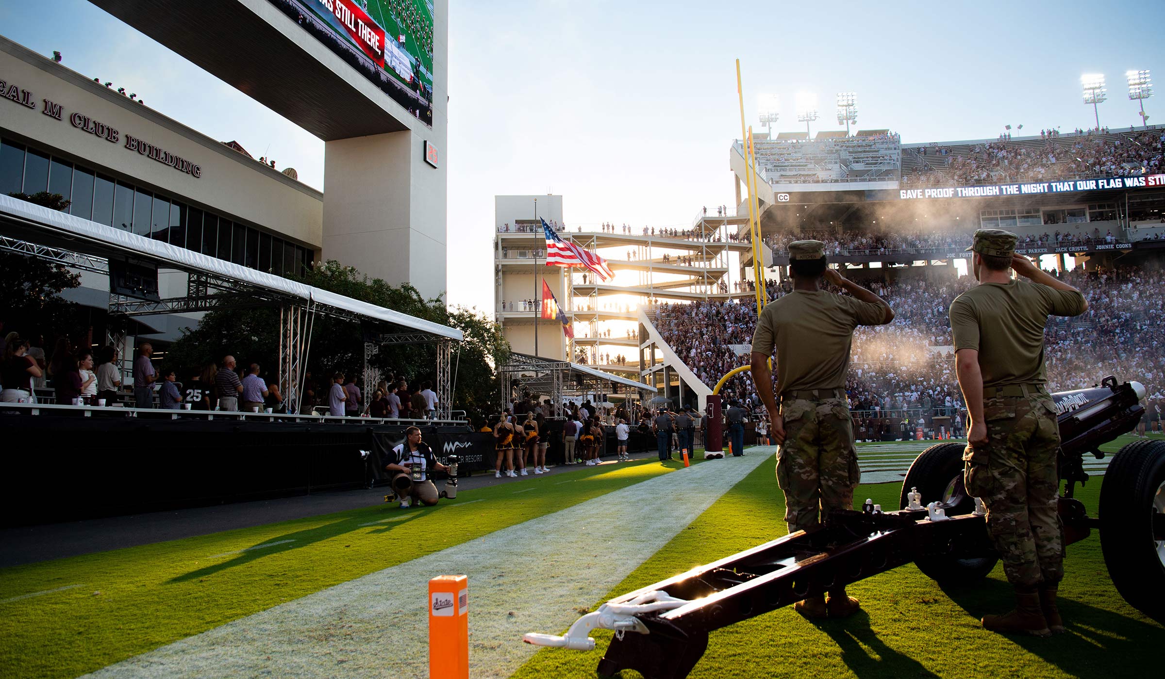 ROTC members salute the flag during the national anthem before kickoff at Davis Wade.
