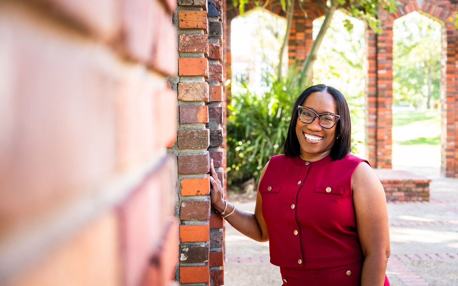 rhonda hannah standing on brick wall