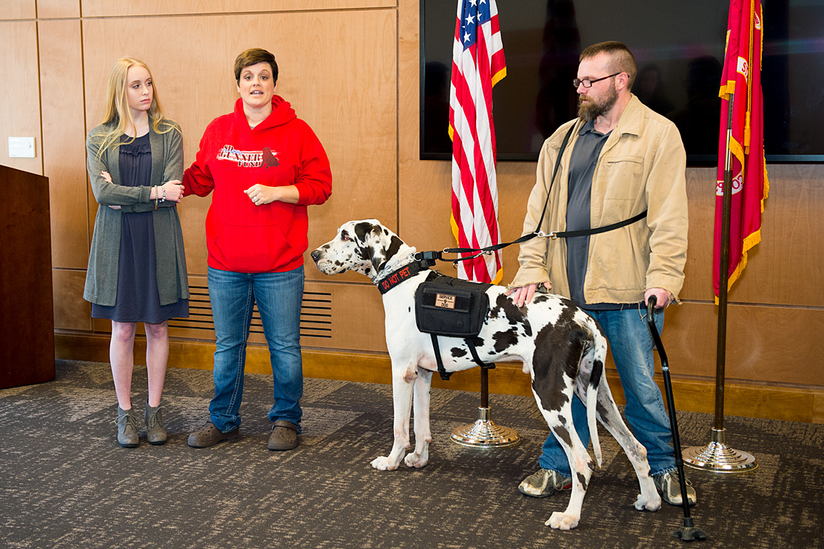 Lance McElhenney receives a service dog at the Center for America&amp;#039;s Veterans.