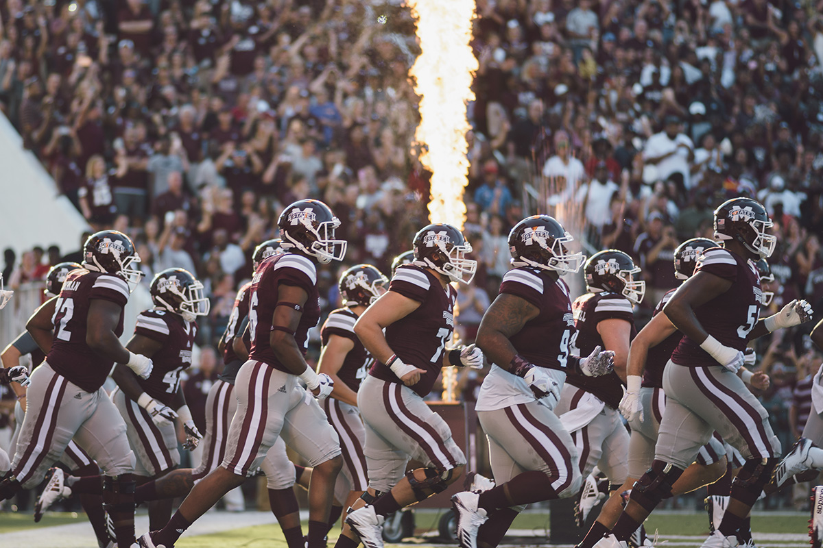 Players run onto field