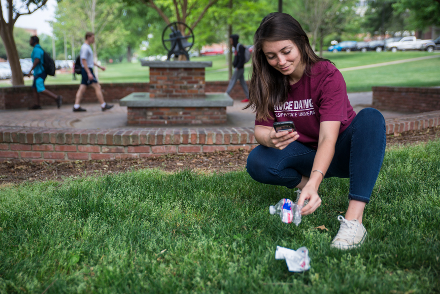 Daisy Grant picking up trash for Earth Week