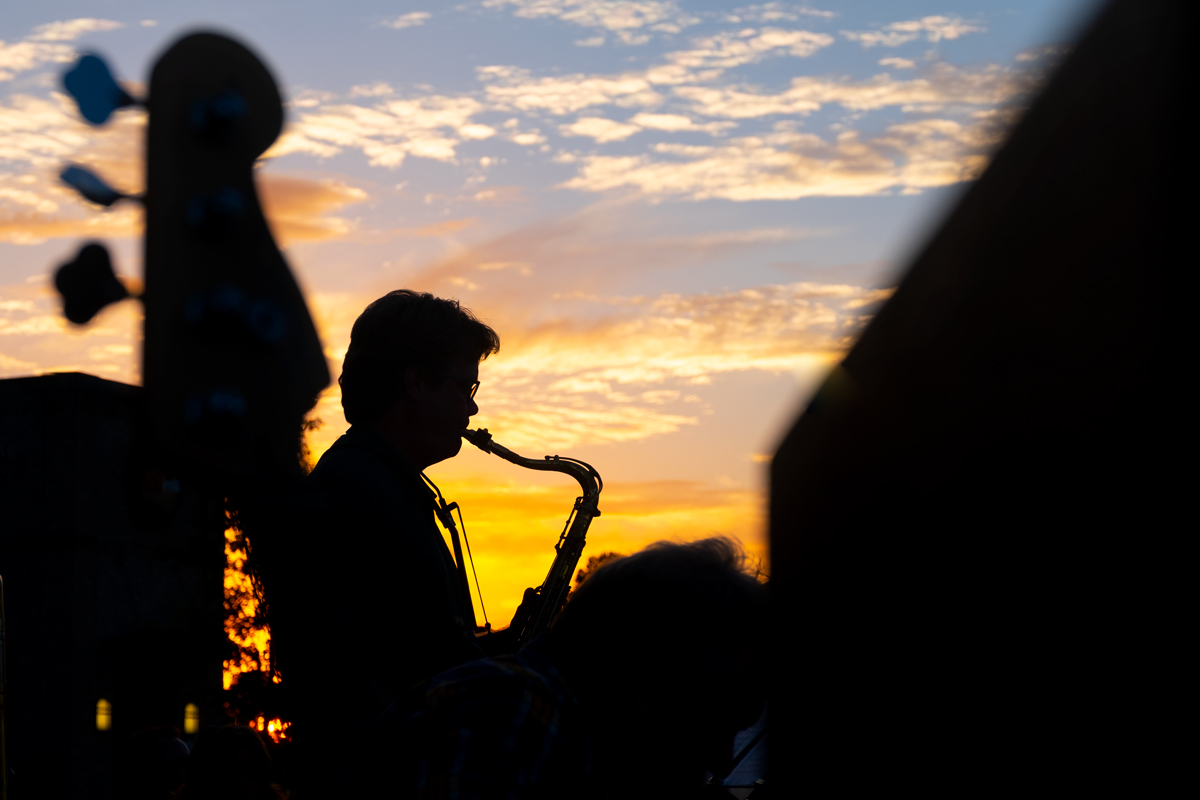 Doug Thomas plays the saxophone as part of the Symphony Jazz Combo, playing outside Renasant Bank