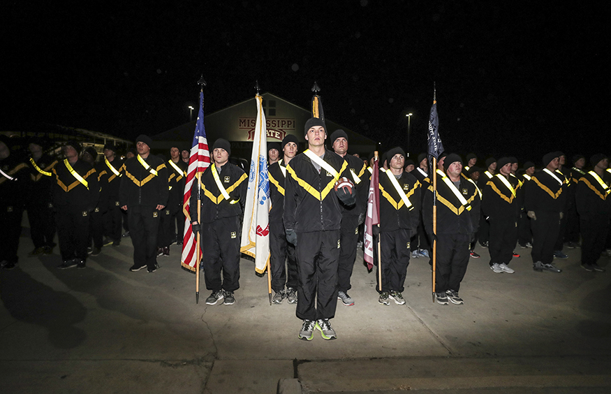 Cadets in Mississippi State’s Army ROTC program deliver the football after completing the 2017 Egg Bowl Run. (Photo by Kelly Donoho)