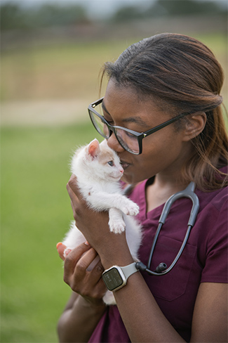 Maxi Malmstrom holds a kitten