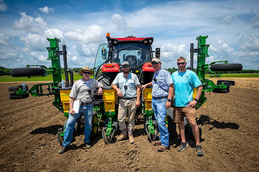 Left to right: Mike Mulvaney, MSU associate professor of plant and soil sciences and Hartwig chair; Dru Carey, agricultural and biological engineering graduate student from Olive Branch; Wes Lowe, assistant professor of agricultural and biological engineering; and John Wallace, research associate II, are pictured with planting equipment. 