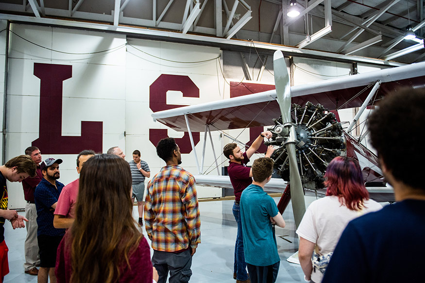 Participants in a Physics Summer Camp, designed for high school students with Autism Spectrum Disorder, take a tour of Mississippi State’s Raspet Flight Research Laboratory. 