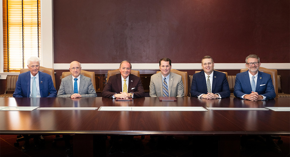 MSU President Mark E. Keenum, center left, and MC President Blake Thompson, center right, signed the 3 + 3 accelerated law degree program Memorandum of Understanding Aug. 21 alongside, from left, MSU Executive Vice Provost Peter Ryan, MSU Provost and Executive Vice President David Shaw, [Keenum and Thompson], MC Provost and Executive Vice President Mike Highfield, and MC School of Law Dean John Anderson. 