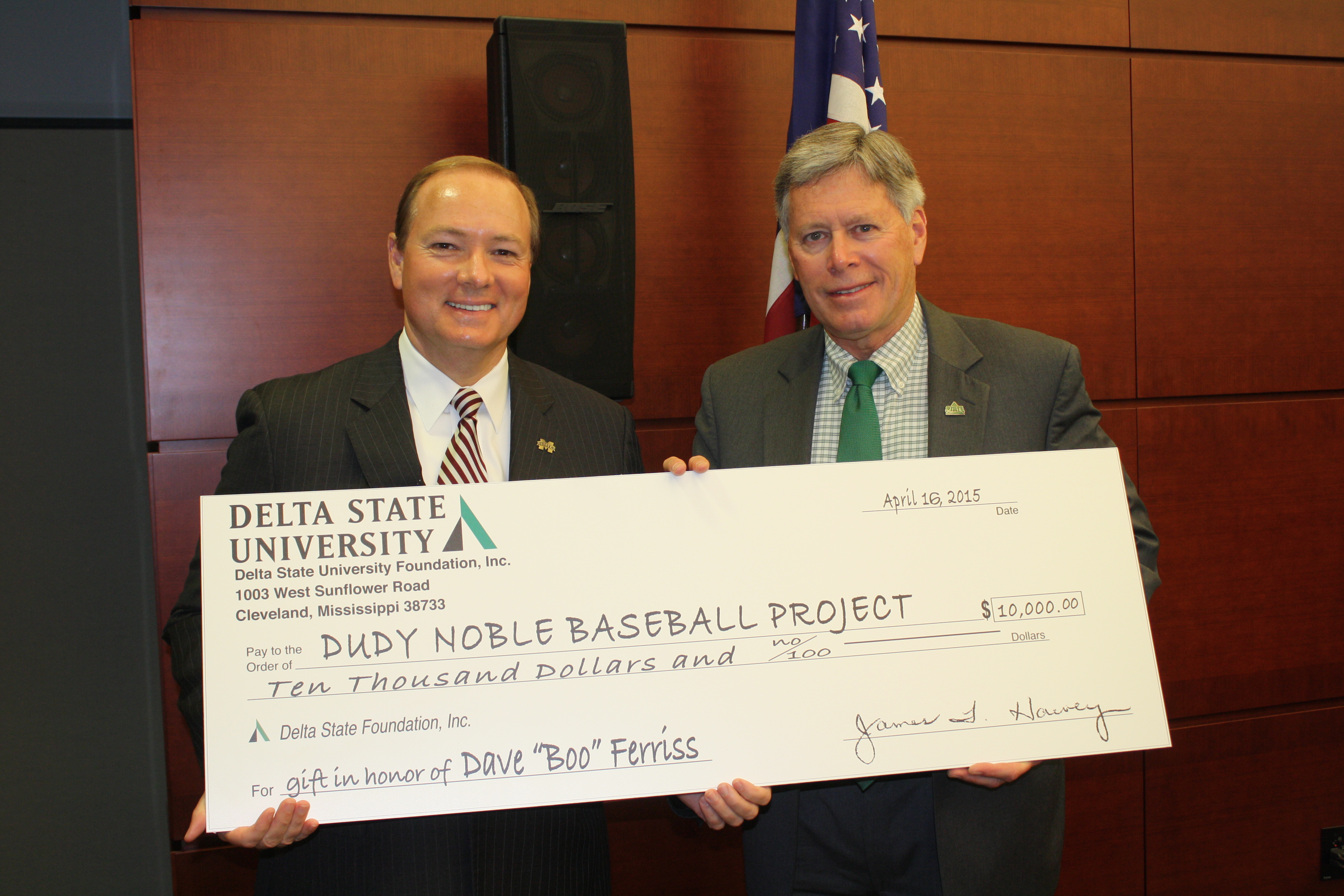 Delta State University President William N. LaForge, right, presented a donation from the DSU Foundation to Mississippi State University's Dudy Noble stadium baseball project to MSU President Mark E. Keenum, left, prior to Thursday's meeting of the state College Board in Jackson. The gift honors former MSU baseball great and longtime DSU coach and administrator David M. "Boo" Ferriss. Ferriss was MSU's first scholarship baseball player and went on to a remarkable career in Major League Baseball with the Boston Red Sox.
