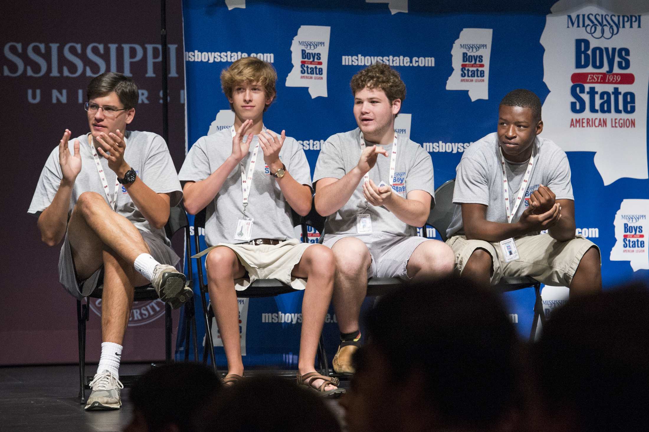 Robert Walker of West Point (l-r), Benjamin Payne and Jack Collins, both of Ridgeland, and Solomon Brown of Greenwood, enjoy the closing awards ceremony for the Mississippi American Legion Boys State program Saturday [May 30] in Lee Hall's Bettersworth Auditorium. Brown and Payne were elected by their peers to travel to the nation's capital for the July 17-24 Boys Nation program. Walker and Collins are serving as alternates in case either delegate is unable to attend. 