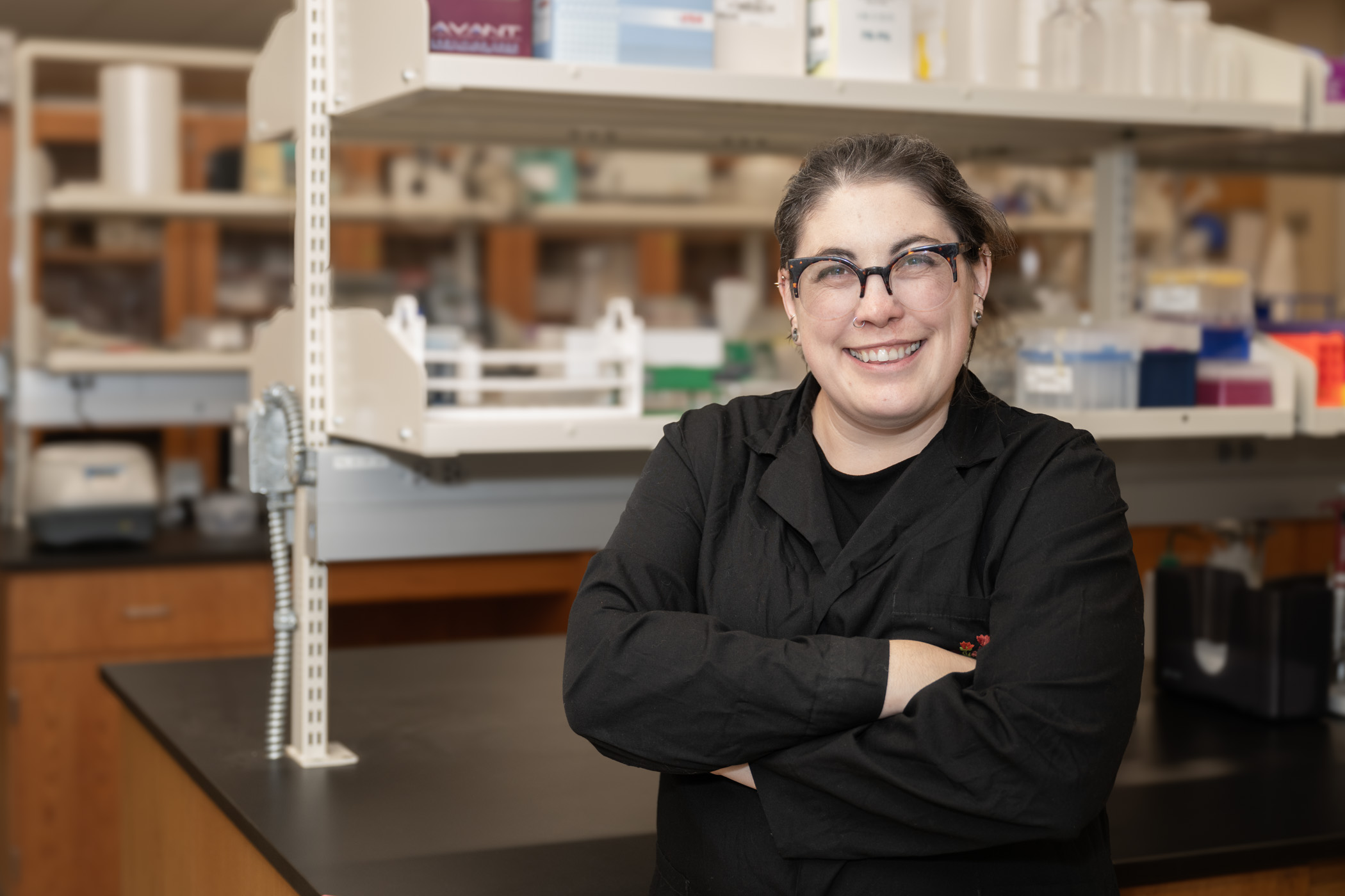 Taylor Szasz Green poses in a laboratory.