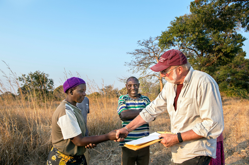 MSU Engineers Without Borders faculty advisor Dennis Truax finalizes an agreement to install a borehole near a school in Simwatachela, Zambia. (Photo by Beth Wynn)