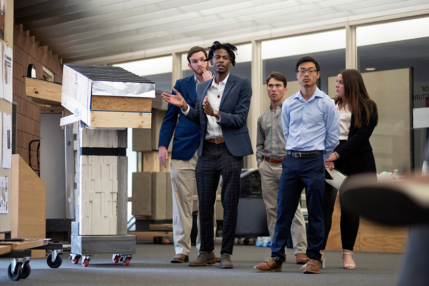 Colby Stalcup, Du’Juan Brown, Tanner Madison, Michael Chew and Mary Stafford Shurden, present their design to a panel of judges. 