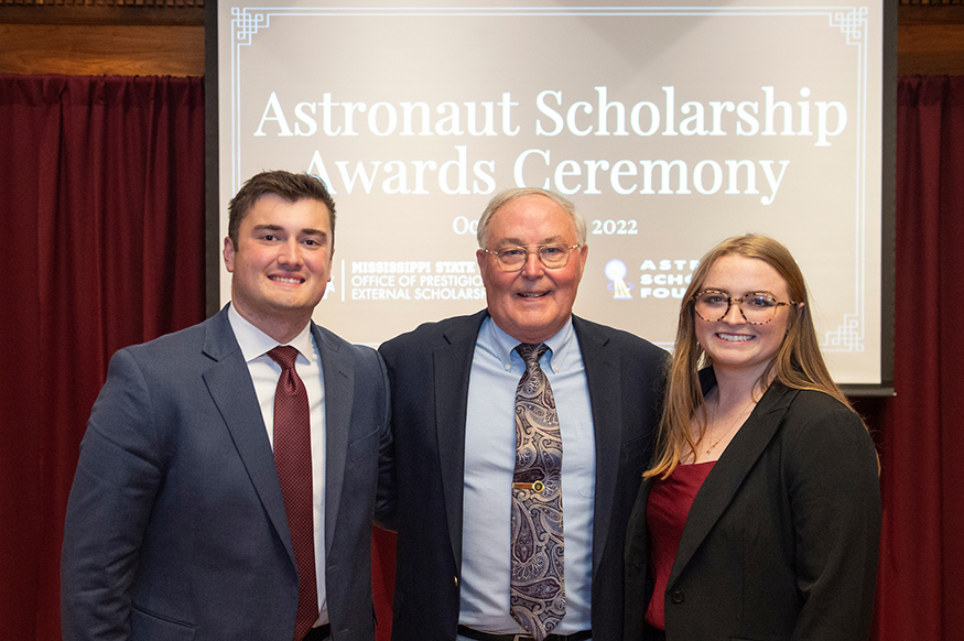 Mississippi State Astronaut Scholars Britain Steele, left, and Emma Wade, right, are pictured with retired NASA Astronaut Jerry Ross