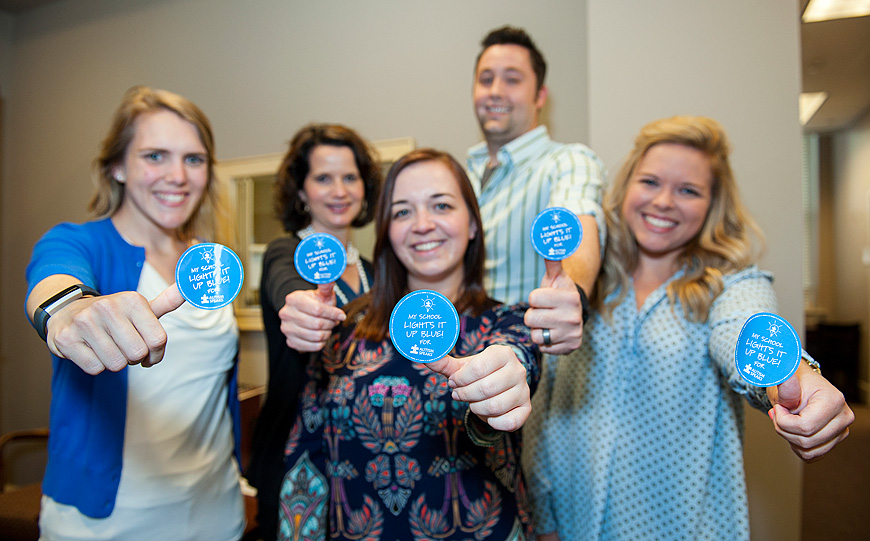 Mississippi State has begun its Autism Speaks campaign in conjunction with Autism Awareness Month in April. As part of the effort, Light It Up Blue stickers will be displayed across campus and the Starkville community. The effort is being led by MSU’s current and former autism liaisons – including (front L-R) Molly Butts of Natchez, Hailey Ripple of Jacksonville, Illinois, and Hallie Smith of Lutz, Florida, all of whom are pursuing doctorates of philosophy in school psychology – as well as (back L-R) Julie Capella, assistant dean and director for Student Support Services; and Dan Gadke, assistant professor for school psychology and director for the Autism and Developmental Disabilities Clinic. (Photo by Russ Houston)   