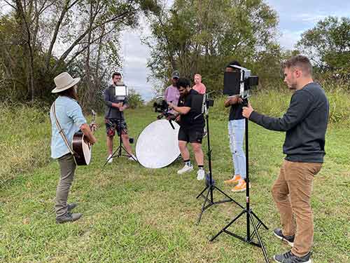 Students in CO 3383 Creative Services Production filming in Starkville with artist, Brandon Green for his music video featuring the single "Float."