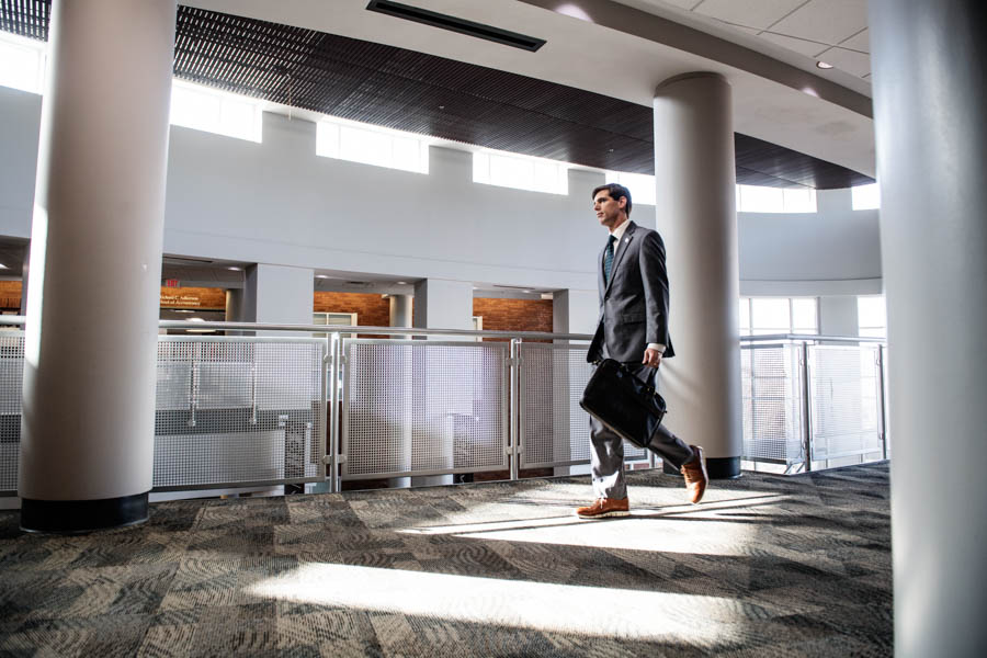 Brian Blank walks in the hallway at McCool Hall