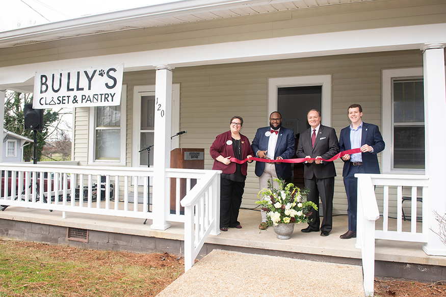 MSU President Mark E. Keenum and other university leaders smile for a group photo during the Bully’s Closet and Pantry ribbon cutting ceremony.