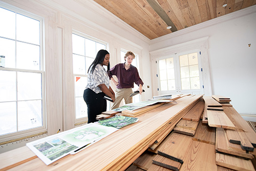 Dia Baldwin of Odenville, Alabama, and Aidan Taylor of Red Banks, both MSU senior interior design majors, discuss a historic renovation project at Waverly Mansion in Clay County. 