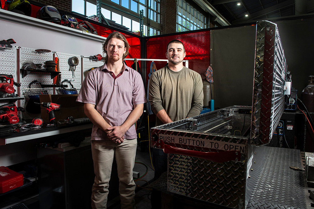 Ryden Smith and Cameron Wesley, pictured in MSU's Center for Advanced Vehicular Systems.