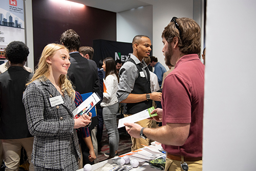 Molleigh Martin, a junior biomedical engineering major from Satsuma, Alabama, speaks to a business representative during the 2023 Spring Career Expo. More than 230 private companies and government agencies are scheduled to attend this year’s fall event, hosted by the MSU Career Center from Sept. 19-21 at The Mill at MSU Conference Center. (Photo by Megan Bean)