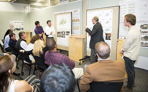 Mississippi State’s Carl Small Town Center collaborated with fall-semester fourth-year students in the university’s School of Architecture to develop a master plan for the 50-acre First Monday Trade Days and Flea Market site in Ripley. Pictured during a recent presentation to Ripley stakeholders are, from left to right, MSU senior architecture majors Asher E. Paxton of Murfreesboro, Tennessee, Matthew T. Lewis of Brandon, MSU School of Architecture Director and F.L. Crane Professor Michael Berk, and Mitchell D. Hubbell of Pensacola, Florida. (Photo by Russ Houston)