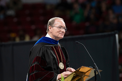 Mark E. Keenum speaks during commencement at Humphrey Coliseum